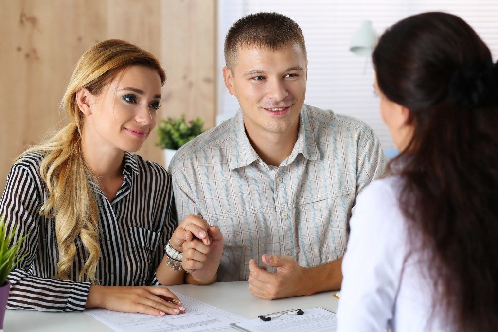 Employee accommodating the couple's questions