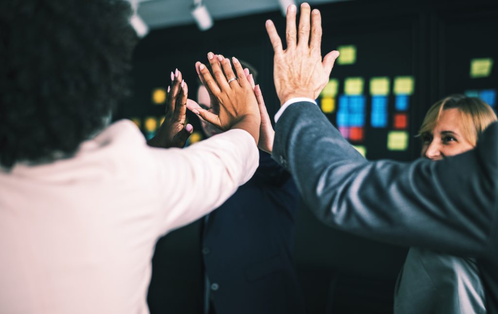 Business team giving a high five