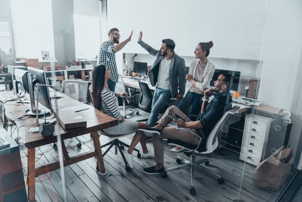 Business employees celebrating