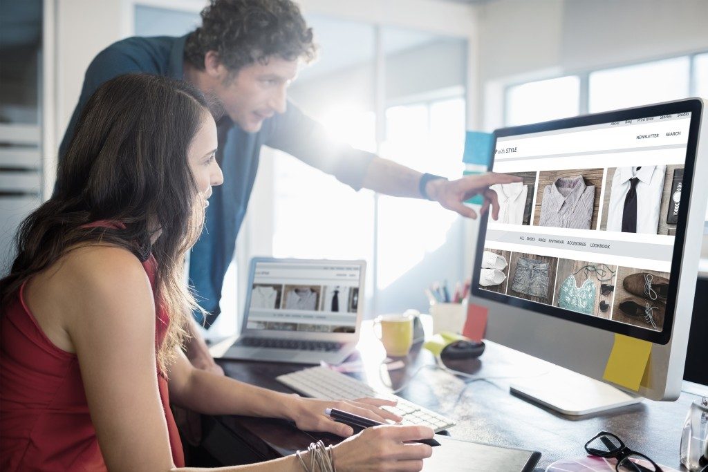 Man and woman looking at the desktop