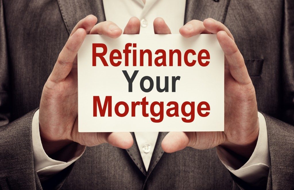 Refinance Your Mortgage card in male hands