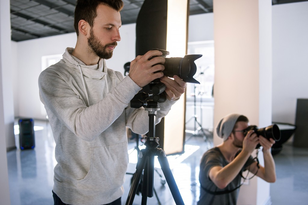 two photographers in a studio