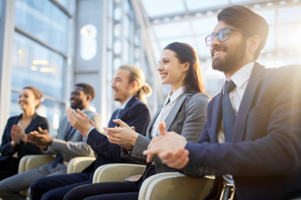 employees clapping their hands