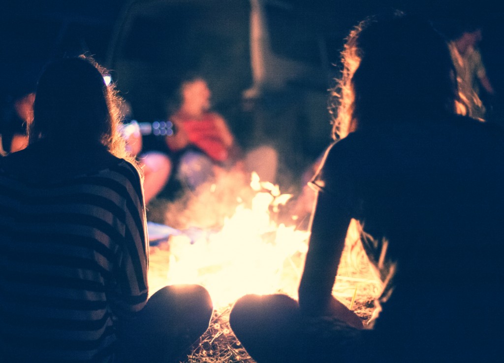people gathered at a bonfire