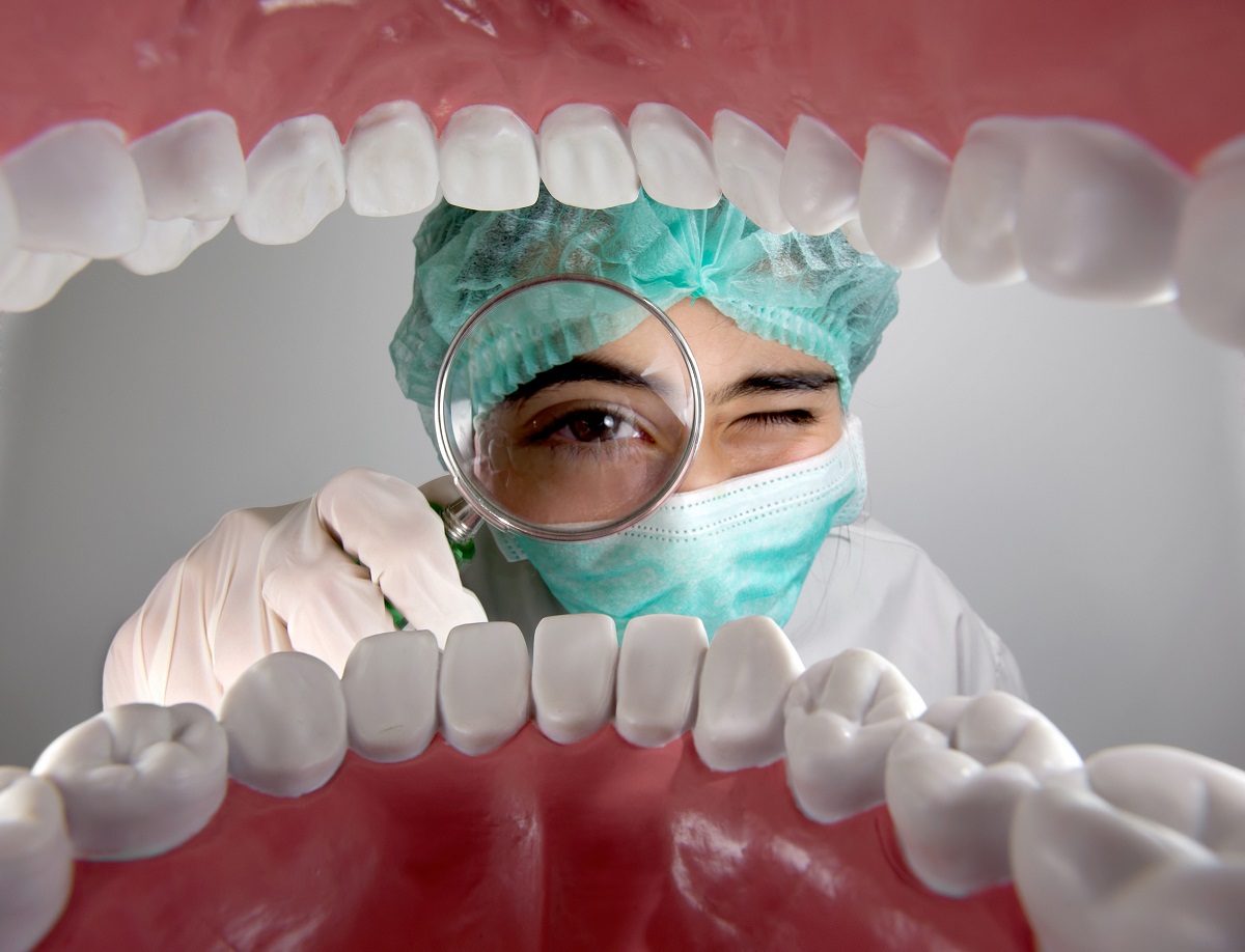 dentist looking into patient's mouth