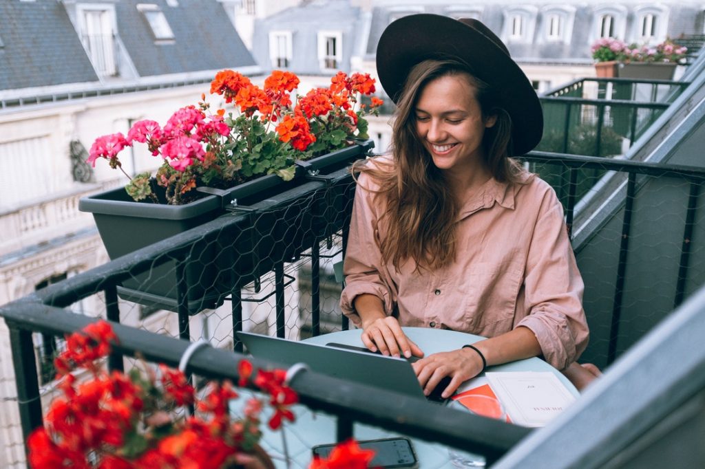 woman working in the balcony