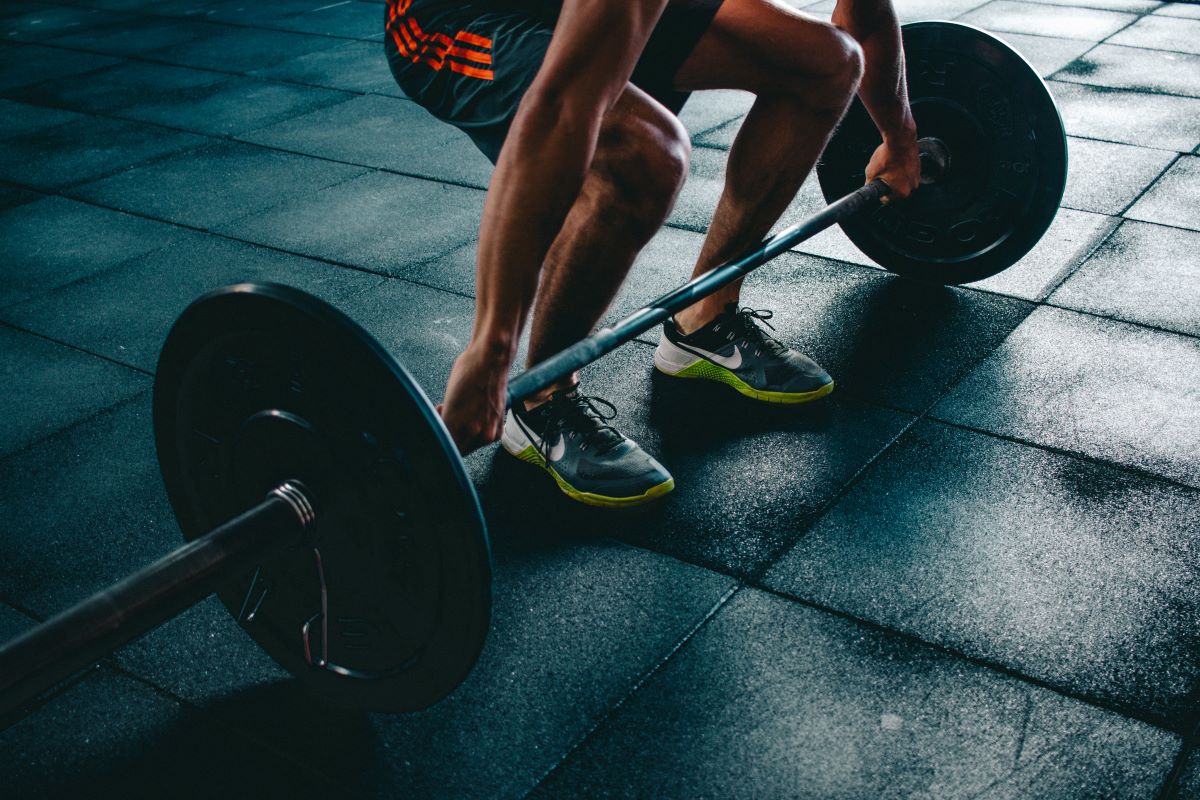 man lifting weights